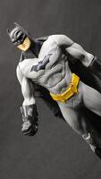 Batman action figure isolated on black background photo