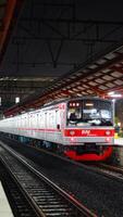 The front view of the train is waiting for passengers photo