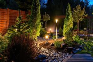 AI generated Light posts illuminated backyard garden during night hours. Modern backyard outdoor lighting systems. photo