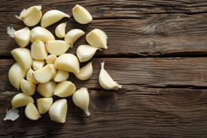 AI generated Fresh peeled garlic cloves on old wooden background. photo