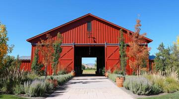 AI generated Red barn constructed on a farm in summer with doors open photo