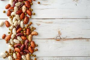 AI generated Mixed dry beans on white wooden board from above. Space for text. photo
