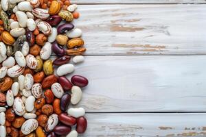AI generated Mixed dry beans on white wooden board from above. Space for text. photo
