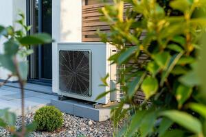 ai generado aire fuente calor bomba instalado en residencial edificio, exhibiendo energía eficiencia y eco simpático calefacción y enfriamiento soluciones sostenible tecnología para reducido carbón huella. foto