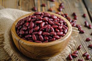 AI generated Closeup red beans or kidney bean in wooden bowl isolated on wood table background. photo