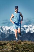 A running man training in the high mountains photo