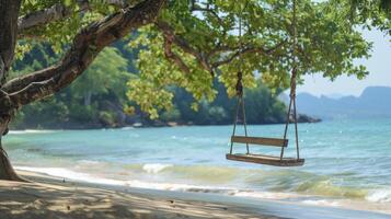 AI generated A wooden bench swing hanging from the branch of an old tree on a beach photo