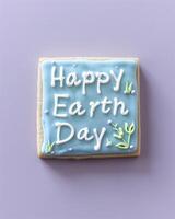 AI generated Happy Earth Day, the text on the blue and white sugar cookie photo