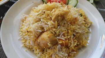 AI generated Chicken biryani on a white plate photo