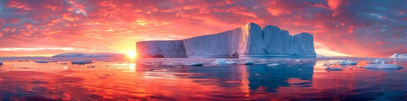 AI generated An iceberg floats gracefully in the ocean as the vibrant colors of the sunset paint the sky. The icebergs jagged edges contrast with the calm water photo