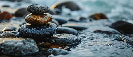 AI generated A serene composition of smoothly balanced stones at the edge of a tranquil seashore, embodying balance and calm photo