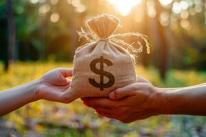 AI generated Two hands exchange a burlap money bag with a dollar sign, symbolizing financial transactions, against a backdrop of golden sunlight and natural greenery photo