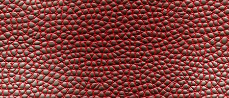 AI generated Detailed snakeskin texture in red and black, perfect for backgrounds or fashion design photo