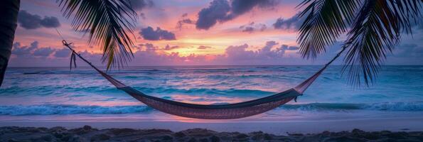 AI generated A hammock is securely tied between two tall palm trees on a sandy beach. The hammock sways gently in the breeze, inviting relaxation and a peaceful moment by the sea photo