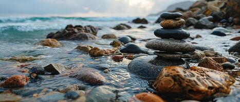 AI generated A serene composition of smoothly balanced stones at the edge of a tranquil seashore, embodying balance and calm photo