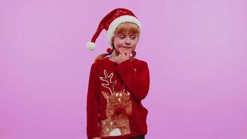 Excited girl in Christmas sweater make gesture raises finger came up with creative plan good idea video