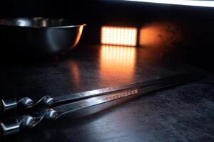 Skewers are on the table for frying meat photo