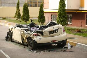 Bucha, Ukraine - April 12, 2022 Cars deliberately smashed by the russian army shooting and shelling in the streets of Bucha town photo