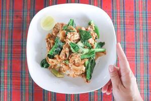 stir fried noodles with pork and vegetable photo