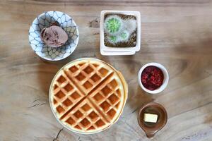 waffle with strawberry dressing and chocolate ice cream photo