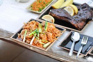 stir fried pork with chinese cabbage and kim chi and bbq or grilled pork photo