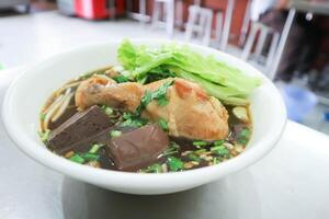 Chinese noodles or chicken noodles photo