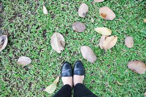 A woman is standing in the garden or in the yard photo