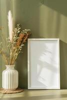 AI generated empty white canvas frame mockup with dried plants in vase on green wall photo