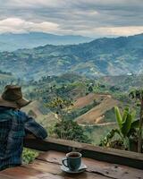 AI generated enjoy a cup of coffee while overlooking a coffee plantation photo