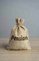 Bag with the word Pension. Ensure financial security during a persons golden years. Employee benefits package. Consider all retirement savings options to ensure a secure financial future. photo