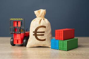 Forklift with shipping containers and euro money bag. Production of containers. GDP and production. Import or export. Trade, economics and transport industry. Tariffs and tax collections. photo