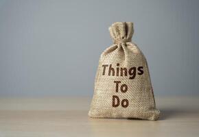 A bag of things to do. Career milestones, personal ambitions, setting goals creates a roadmap for success. Fulfilling goals. Performing tasks. Planning ahead photo