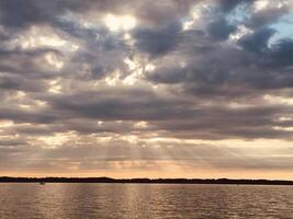 Sun Beams Over the Water photo