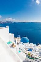 Europe travel in Santorini Greece cruise vacation. Amazing summer holiday, blue dome, church over blue sea bay and beautiful seascape. Famous travel destination luxury vacation over white architecture photo