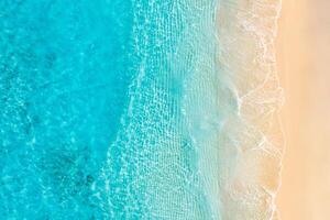 Relaxing aerial beach scene, summer vacation holiday template banner. Waves surf with amazing blue ocean lagoon, sea shore, coastline. Perfect aerial drone top view. Peaceful bright beach, seaside photo