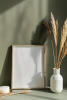 AI generated empty white canvas frame mockup with dried plants in vase on green wall photo