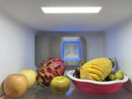 Fresh fruits and eggs in the refrigerator photo