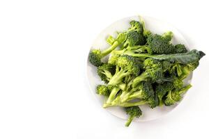 Healthy Green Organic Raw Broccoli Florets Ready for Cooking on white background. top view photo