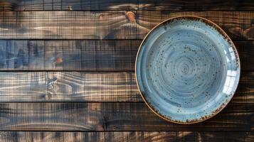 ai generado cerámico azul plato en madera antecedentes parte superior vista. foto
