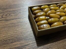 Dates in a typical Ramadan food box are healthy sweet fruits consumed after fasting photo