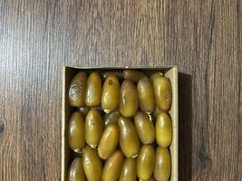 Dates in a typical Ramadan food box are healthy sweet fruits consumed after fasting photo