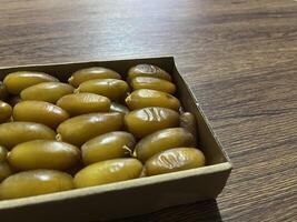 Dates in a typical Ramadan food box are healthy sweet fruits consumed after fasting photo