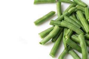 Fresh chopped green beans isolated on white background photo