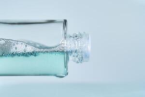 Bottles with serum on a blue background. photo