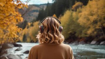 AI generated Music therapy, harmony, mental health concept. Pretty young woman enjoying music with headphones outdoors. Woman wearing headphones enjoying music and good vibes photo