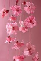 AI generated hanged floated flowers, pink theme photo