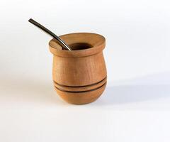 Calabash and bombilla for Yerba Mate tea on a white background. Mate is a traditional Argentine tea. photo