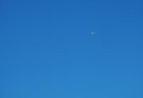 Airplane against a background of blue sky on a sunny day. photo