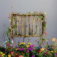AI generated A handmade wooden sign hung by vine ropes and surrounded by colorful flowers photo
