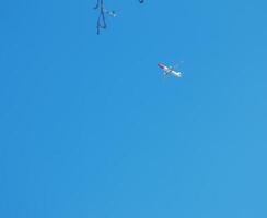 Airplane against a background of blue sky on a sunny day. photo